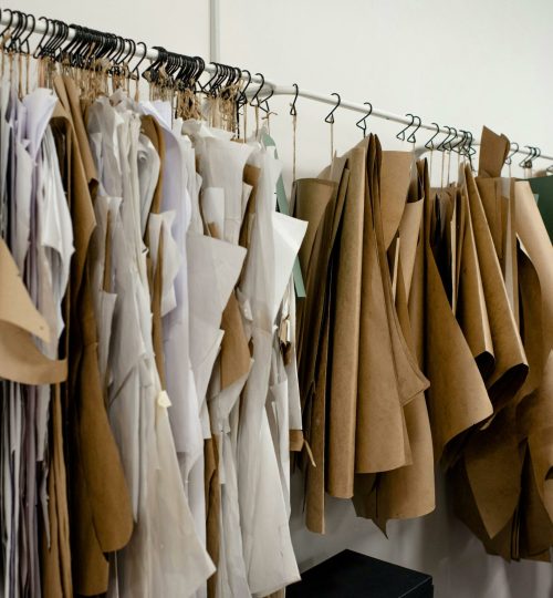 Organized sewing patterns in a fashion designer's studio, ideal for tailoring or design concepts.